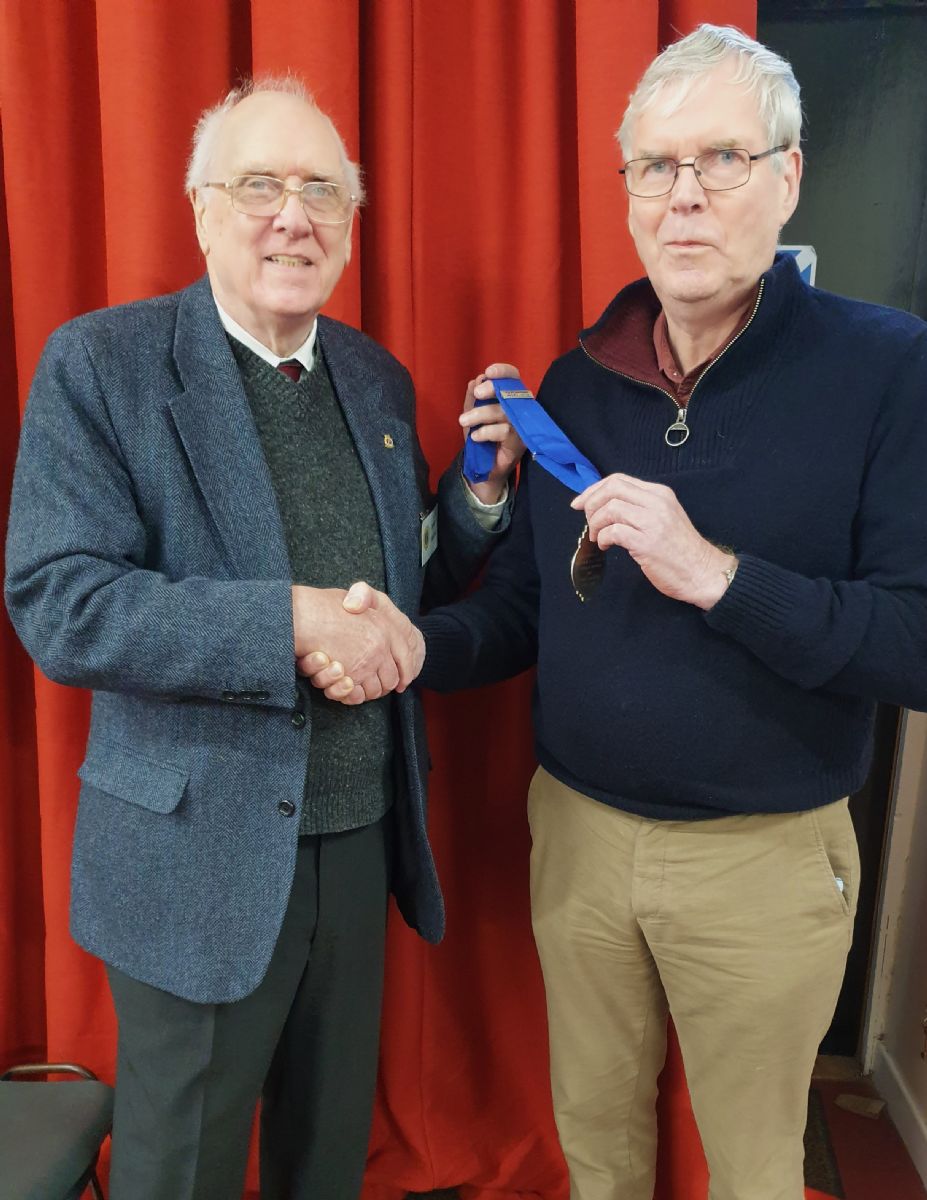 David Martin hands over to new Chairman, John Parker.